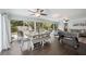 Casual dining area with table and bench, adjacent to a foosball table at 2425 Clematis St, Sarasota, FL 34239