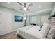 Main bedroom with a king-size bed and built-in shelving at 2425 Clematis St, Sarasota, FL 34239