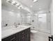 Clean bathroom with a walk-in shower and dark vanity at 2425 Clematis St, Sarasota, FL 34239