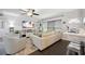 Open living space featuring a sectional sofa and large TV at 2425 Clematis St, Sarasota, FL 34239
