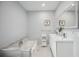 Clean bathroom with double vanity and a large mirror at 2425 Clematis St, Sarasota, FL 34239