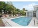 Inviting backyard oasis featuring a refreshing pool, lounge chairs, and lush landscaping at 2425 Clematis St, Sarasota, FL 34239