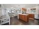 Updated kitchen with breakfast bar and open view to living room at 2425 Clematis St, Sarasota, FL 34239