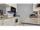 Kitchen with granite countertops, white cabinets and appliances at 2911 74Th W St # 2276, Bradenton, FL 34209