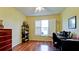 Bright home office features wood floors, built-in shelving, and large window with shutters at 2911 74Th W St # 2276, Bradenton, FL 34209