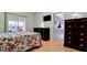 Bedroom with dresser, and access to the Florida Room and bathroom at 2911 74Th W St # 2276, Bradenton, FL 34209