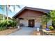 Clubhouse entrance with stonework, double doors, and a bench at 2911 74Th W St # 2276, Bradenton, FL 34209