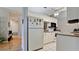 Bright kitchen features granite countertops and white cabinets at 2911 74Th W St # 2276, Bradenton, FL 34209