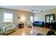 Living room with hardwood floors, seating area, and built-in cabinet at 2911 74Th W St # 2276, Bradenton, FL 34209