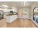 Spacious kitchen features an island, stainless steel appliances, and access to patio at 2837 Cabaret St, Port Charlotte, FL 33948