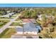Aerial view of a single-Gathering home with a pool and landscaped yard at 2837 Cabaret St, Port Charlotte, FL 33948