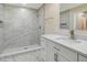 Modern bathroom with marble shower and white cabinetry at 2837 Cabaret St, Port Charlotte, FL 33948