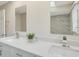 Modern bathroom with double vanity, marble shower, and updated fixtures at 2837 Cabaret St, Port Charlotte, FL 33948