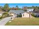 Single-story home with a driveway and landscaped yard at 2837 Cabaret St, Port Charlotte, FL 33948