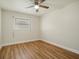 Simple bedroom with hardwood floor and a window at 2837 Cabaret St, Port Charlotte, FL 33948