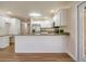 Modern kitchen with island, stainless steel appliances, and white cabinetry at 2837 Cabaret St, Port Charlotte, FL 33948