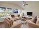 Living room with hardwood floors, neutral walls, and ample natural light at 2837 Cabaret St, Port Charlotte, FL 33948