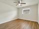 Simple bedroom with hardwood floors and a ceiling fan at 2837 Cabaret St, Port Charlotte, FL 33948