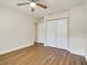 Well-lit bedroom with hardwood floor and double door closet at 2837 Cabaret St, Port Charlotte, FL 33948