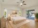 Spacious main bedroom with wood flooring and sliding doors to patio at 2837 Cabaret St, Port Charlotte, FL 33948