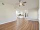 Bright living room with hardwood floors and view into kitchen at 2837 Cabaret St, Port Charlotte, FL 33948