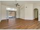 Spacious living room featuring hardwood floors, vaulted ceiling, and access to the pool area at 2837 Cabaret St, Port Charlotte, FL 33948