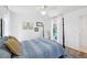 Bedroom with a four-poster bed, ceiling fan, and view of the backyard pool at 218 Brandywine Circle, Englewood, FL 34223