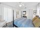 Bedroom featuring a four-poster bed, ceiling fan, and view of the Primary bath at 218 Brandywine Circle, Englewood, FL 34223