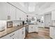 Spacious kitchen featuring granite countertops, stainless steel appliances, and ample cabinet space at 218 Brandywine Circle, Englewood, FL 34223