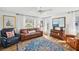 Cozy living room featuring comfortable seating, bright windows, and stylish decor at 218 Brandywine Circle, Englewood, FL 34223