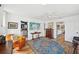 Bright living room with hardwood floors, comfortable furniture, and seamless access to bedrooms and bath at 218 Brandywine Circle, Englewood, FL 34223