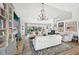 Spacious living room showcasing a fireplace, vaulted ceilings, custom shelving, and elegant chandelier at 218 Brandywine Circle, Englewood, FL 34223