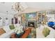 Inviting living room with fireplace, custom built-ins, and comfortable seating arrangement at 218 Brandywine Circle, Englewood, FL 34223