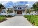 The Beach Club main building with attractive architecture and landscaping at 327 Compass Point Dr # 201, Bradenton, FL 34209