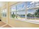 Bedroom with large windows offering a picturesque water view at 327 Compass Point Dr # 201, Bradenton, FL 34209