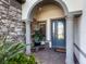 Elegant house entrance with stone accents and arched entryway at 7989 Grande Shores Dr, Sarasota, FL 34240