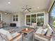 Relaxing screened patio with seating and outdoor kitchen at 7996 Sandstar Way, Sarasota, FL 34240