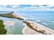 Aerial view of coastline with serene waterway and ocean waves at 9397 Midnight Pass Rd # 505, Sarasota, FL 34242