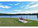Tranquil waterfront seating area with benches and scenic views at 9397 Midnight Pass Rd # 505, Sarasota, FL 34242