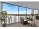 Spacious screened balcony boasting amazing water views and ample seating at 9397 Midnight Pass Rd # 505, Sarasota, FL 34242