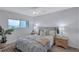 Guest bedroom with a queen-size bed and ocean view at 9397 Midnight Pass Rd # 505, Sarasota, FL 34242