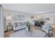 Spacious living area features a comfy sofa and access to the kitchen at 9397 Midnight Pass Rd # 505, Sarasota, FL 34242