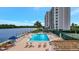 Community pool and tennis courts with waterfront access at 9397 Midnight Pass Rd # 505, Sarasota, FL 34242