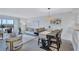 Open concept dining area with a dark wood table and seating for four at 9397 Midnight Pass Rd # 505, Sarasota, FL 34242