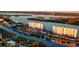 Aerial view of waterfront condos with parking and resort-style amenities at 9397 Midnight Pass Rd # 505, Sarasota, FL 34242
