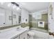 Bathroom with tub, shower, and updated vanity at 9397 Midnight Pass Rd # 505, Sarasota, FL 34242