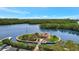 Scenic waterfront gazebo with lush landscaping and tranquil waterway at 9397 Midnight Pass Rd # 505, Sarasota, FL 34242