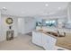 Modern white kitchen with granite countertops and stainless steel appliances at 9397 Midnight Pass Rd # 505, Sarasota, FL 34242