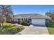 Charming single-story home with a tile roof and landscaped yard at 218 Brandywine Circle, Englewood, FL 34223