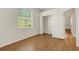 Bedroom with wood-look flooring and a large closet at 4193 Westbourne Cir, Sarasota, FL 34238